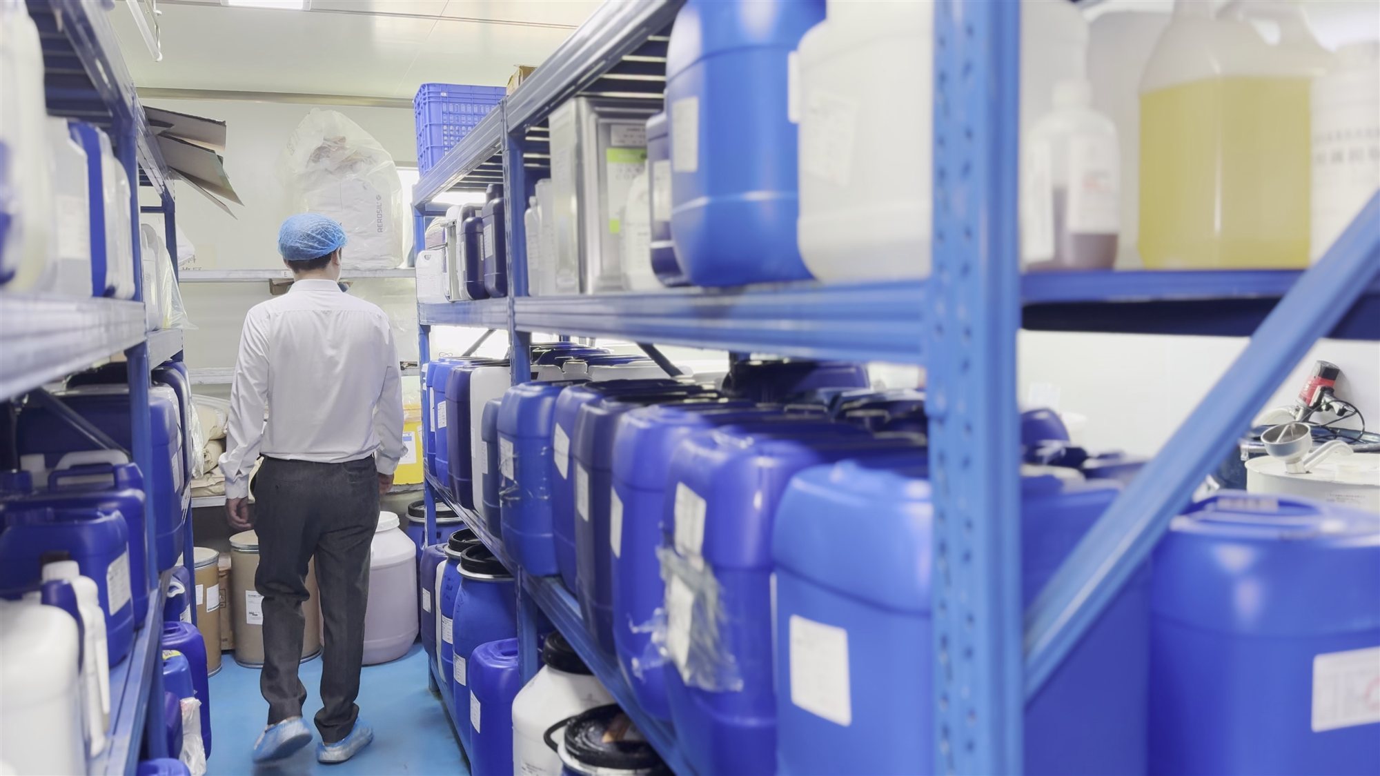 Tyler, founder of jogonglabs, walking through the production area of the factory