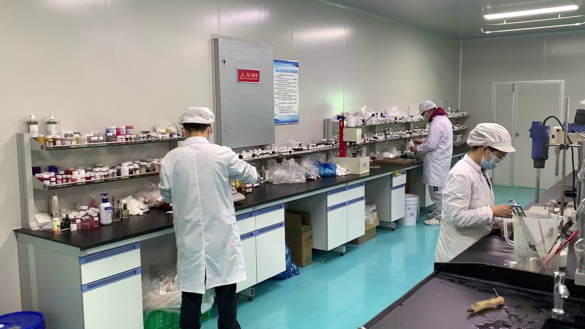Cosmetic laboratory team checking a formulation