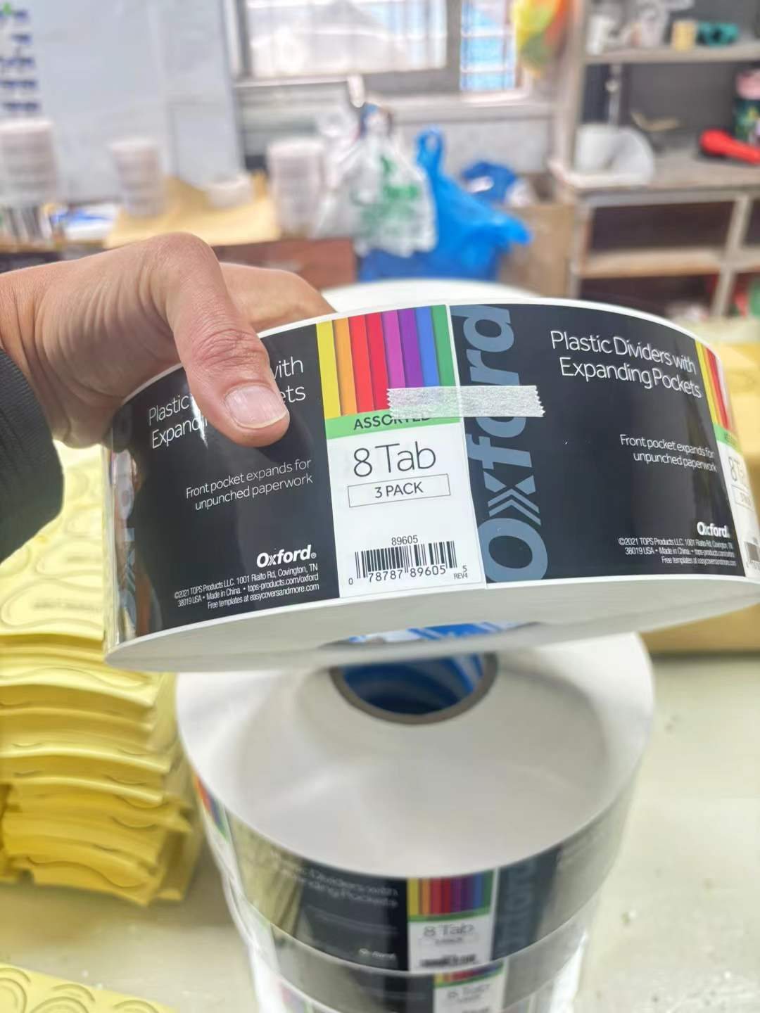 Checking a printed colour swatch against packaging components at the jogonglabs factory