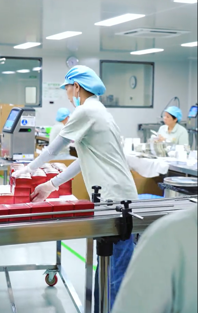 Filling and packaging line inside a GMP-certified skincare factory